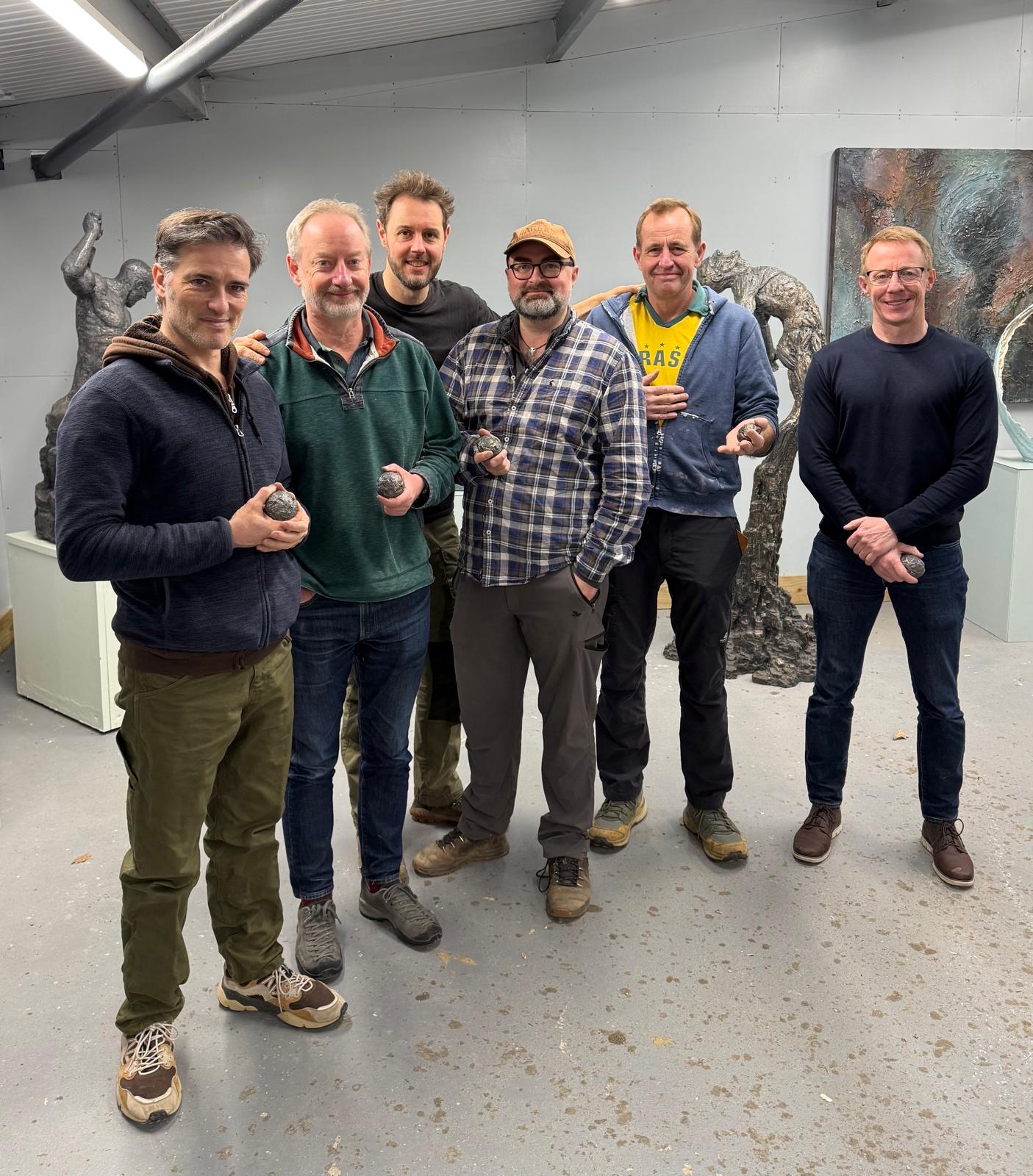 Ian Edwards with a group in the sculpture studio during a Live Your Calling workshop